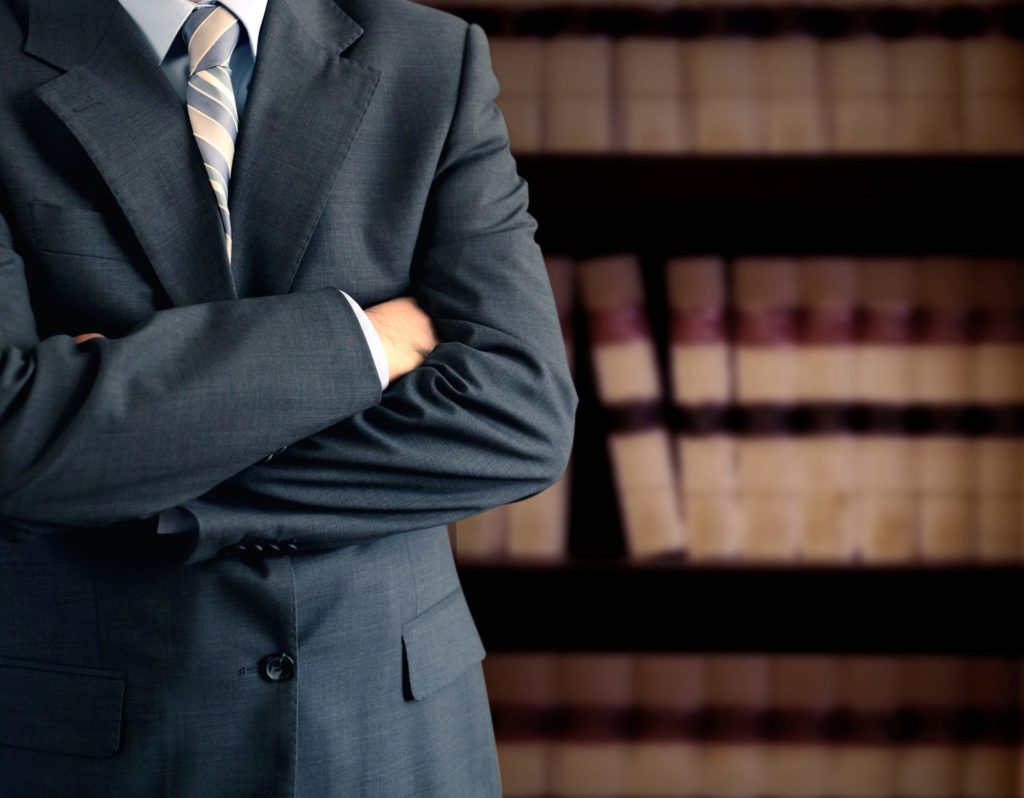 Businessman In Front Of Bookcase Solnick Law - Business and Commercial Litigation - Fort Lauderdale Attorney